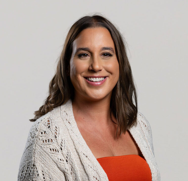 Administrative staff at Move Forward Counseling smiling in to the camera for a headshot.