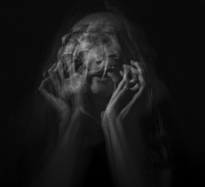 An image of a woman screaming as she holds her face. This could represent the inner pain eating disorder treatment in Hershey, PA can help you overcome. Contact an eating disorder therapist in Hershey, PA to learn more about online therapy for eating disorders in Allentown, PA today! 17033