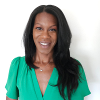 Natassia Levine, administrative assistant, smiling for a headshot